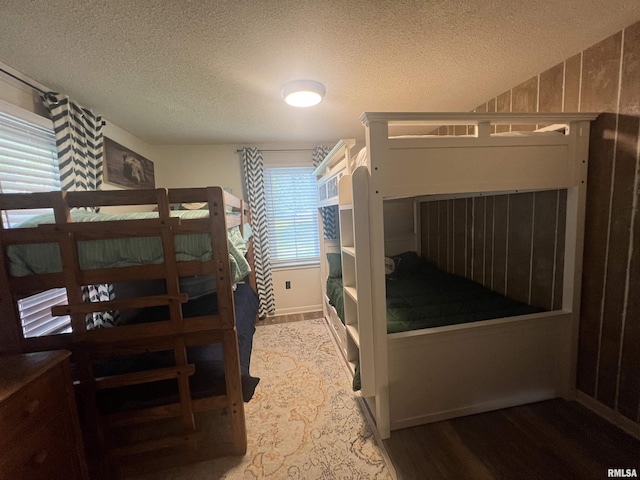 1150 Lakeview Dr, Creal Springs, IL 62922 - bedroom featuring wood finished floors, a textured ceiling, and baseboards