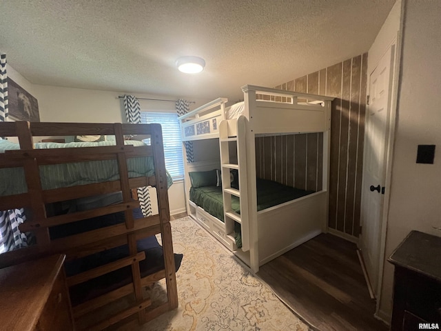 1150 Lakeview Dr, Creal Springs, IL 62922 - bedroom with wood finished floors, a textured ceiling, and baseboards