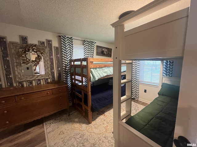 1150 Lakeview Dr, Creal Springs, IL 62922 - bedroom with a textured ceiling and wood finished floors