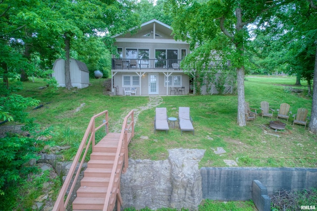 1150 Lakeview Dr, Creal Springs, IL 62922 - rear view of property with stairs, a lawn, a fire pit, and a wooden deck