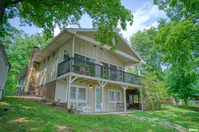 1150 Lakeview Dr, Creal Springs, IL 62922 - view of front of house with a front yard, a chimney, and a wooden deck