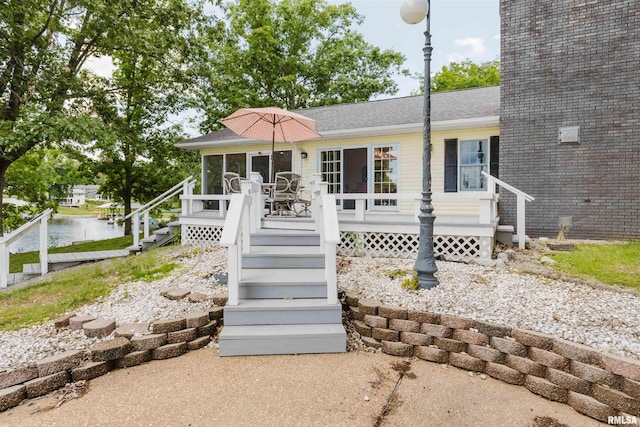 12897 Egypt Shores Dr, Creal Springs, IL 62922 - view of front of property with stairs, a deck, a sunroom, and roof with shingles
