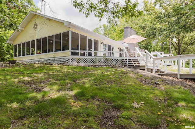 12897 Egypt Shores Dr, Creal Springs, IL 62922 - rear view of property with a sunroom, a wooden deck, and a chimney