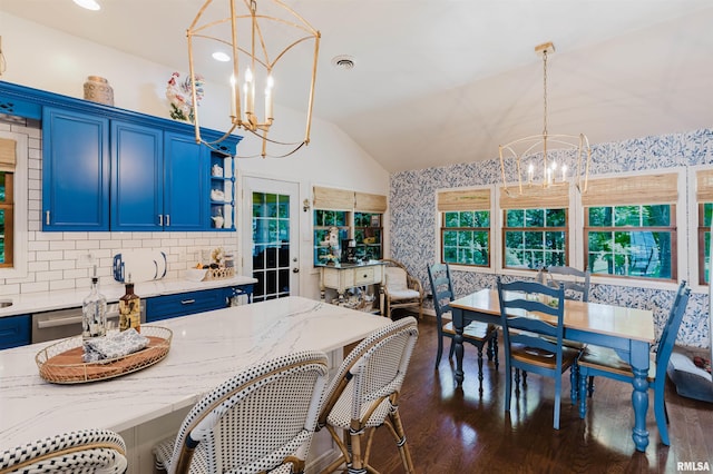 12897 Egypt Shores Dr, Creal Springs, IL 62922 - kitchen with a chandelier, blue cabinetry, vaulted ceiling, dark wood-style floors, and a breakfast bar