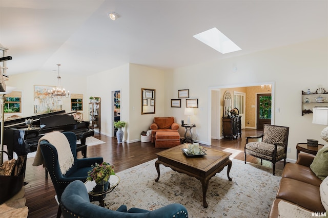 12897 Egypt Shores Dr, Creal Springs, IL 62922 - living room featuring a chandelier, a skylight, lofted ceiling, wood finished floors, and baseboards