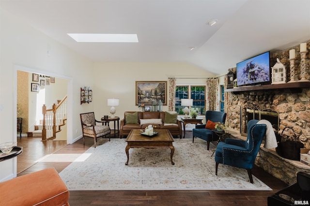 12897 Egypt Shores Dr, Creal Springs, IL 62922 - living room with a skylight, lofted ceiling, wood finished floors, stairway, and a fireplace