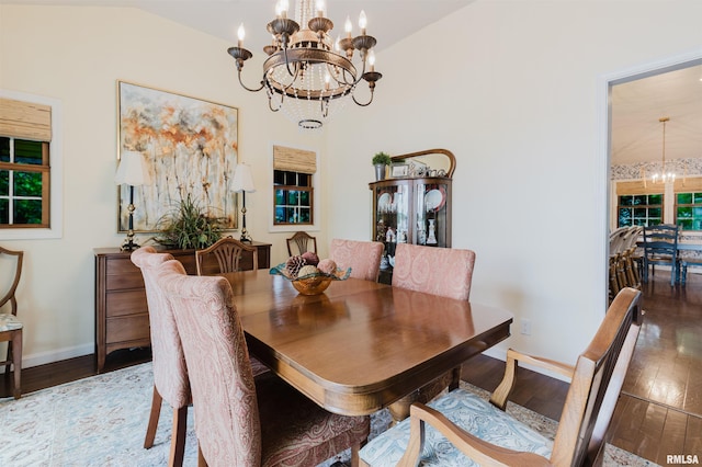 12897 Egypt Shores Dr, Creal Springs, IL 62922 - dining area featuring a chandelier, wood-type flooring, and baseboards