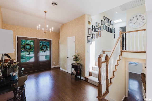 12897 Egypt Shores Dr, Creal Springs, IL 62922 - entrance foyer with wood finished floors, stairway, a chandelier, french doors, and baseboards