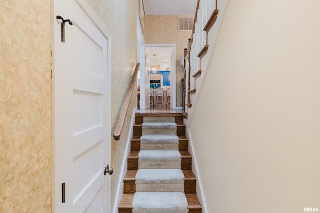 12897 Egypt Shores Dr, Creal Springs, IL 62922 - staircase with wallpapered walls and wood finished floors