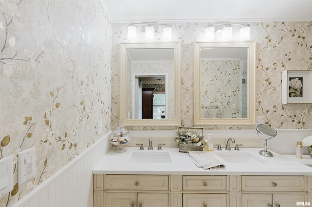 12897 Egypt Shores Dr, Creal Springs, IL 62922 - bathroom featuring wallpapered walls, double vanity, wainscoting, and crown molding