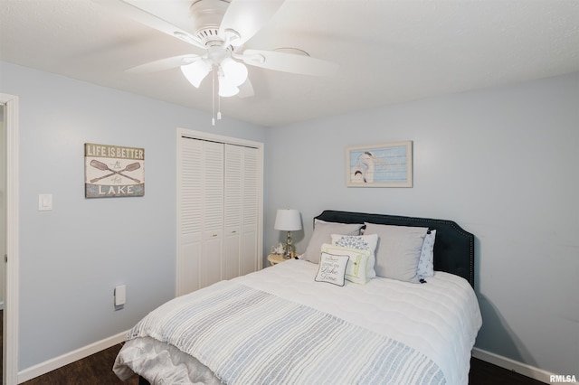 12897 Egypt Shores Dr, Creal Springs, IL 62922 - bedroom featuring wood finished floors, a closet, baseboards, and ceiling fan