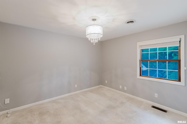 12897 Egypt Shores Dr, Creal Springs, IL 62922 - carpeted spare room featuring a chandelier and baseboards