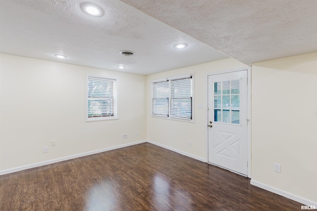12897 Egypt Shores Dr, Creal Springs, IL 62922 - unfurnished room with a textured ceiling, wood finished floors, baseboards, and recessed lighting