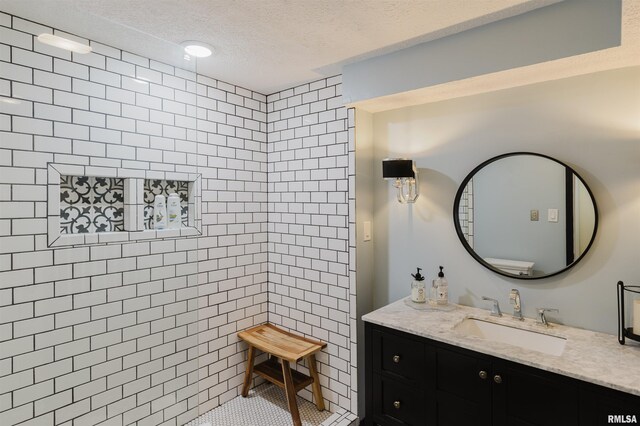 12897 Egypt Shores Dr, Creal Springs, IL 62922 - bathroom with a textured ceiling and vanity