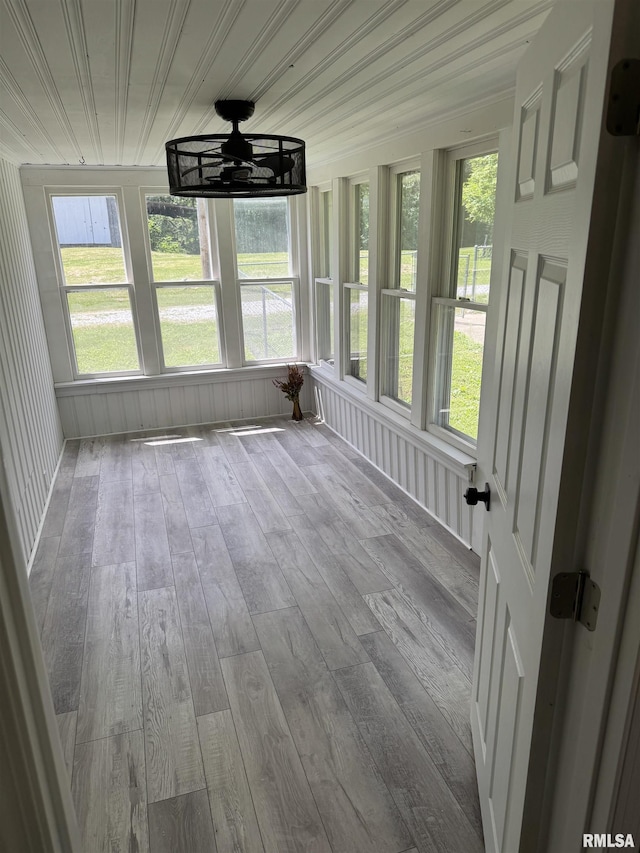 6984 Washington St, Mulkeytown, IL 62865 - unfurnished sunroom featuring wood-type flooring