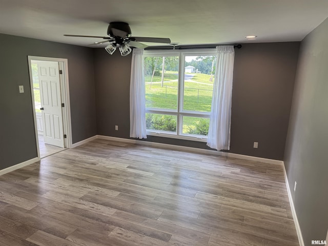 6984 Washington St, Mulkeytown, IL 62865 - empty room featuring ceiling fan, wood finished floors, and baseboards