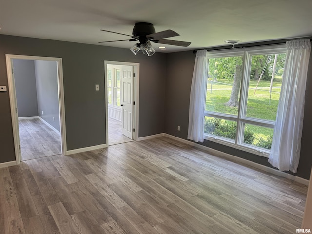 6984 Washington St, Mulkeytown, IL 62865 - unfurnished room with a ceiling fan, wood finished floors, and baseboards