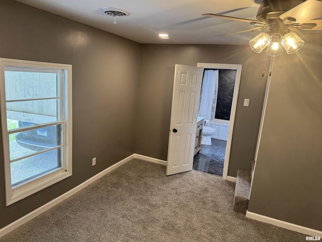 6984 Washington St, Mulkeytown, IL 62865 - carpeted spare room featuring ceiling fan, plenty of natural light, and baseboards