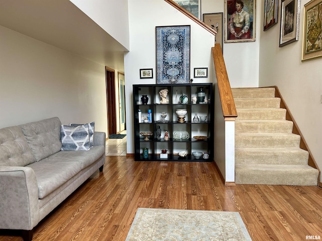 108 N Gordon Ln, Carbondale, IL 62901 - living area featuring stairway, wood finished floors, and a towering ceiling