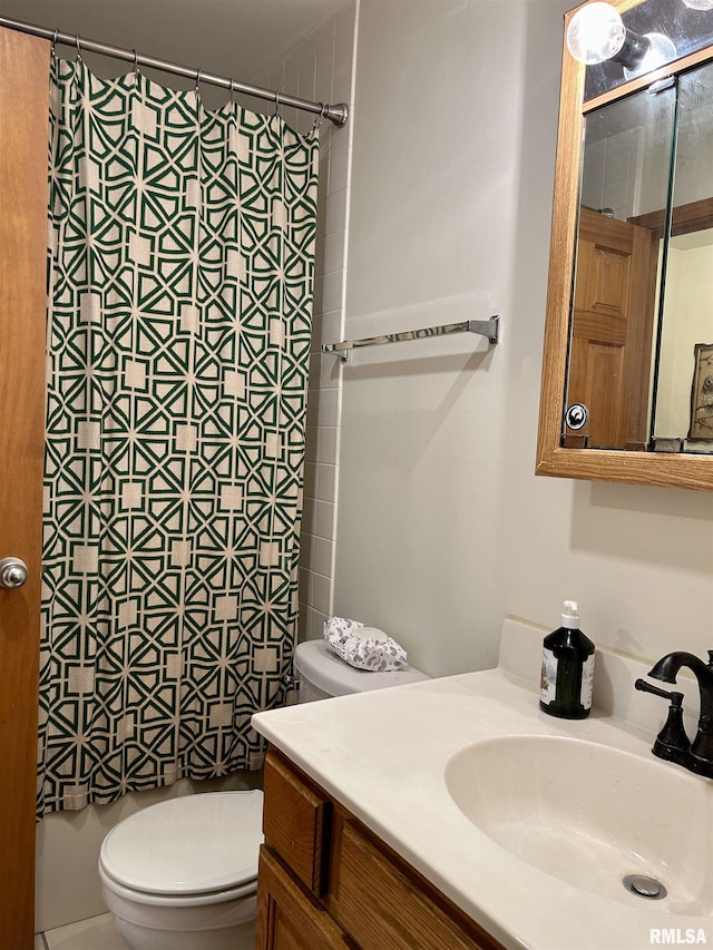 108 N Gordon Ln, Carbondale, IL 62901 - bathroom with toilet, vanity, and a shower with shower curtain