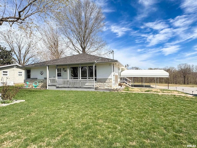 310 Williford Rd, Jonesboro, IL 62952 - back of property featuring a detached carport, a porch, driveway, a yard, and stone siding