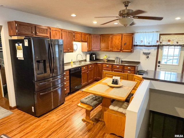 310 Williford Rd, Jonesboro, IL 62952 - kitchen with fridge with ice dispenser, black dishwasher, a sink, light wood-type flooring, and ceiling fan