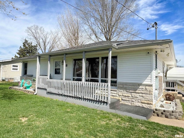310 Williford Rd, Jonesboro, IL 62952 - view of front facade featuring a porch, a front yard, and stone siding