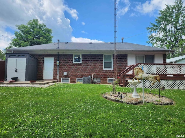 605 Pace Ave, Mount Vernon, IL 62864 - rear view of house featuring a lawn, brick siding, central air condition unit, and a wooden deck