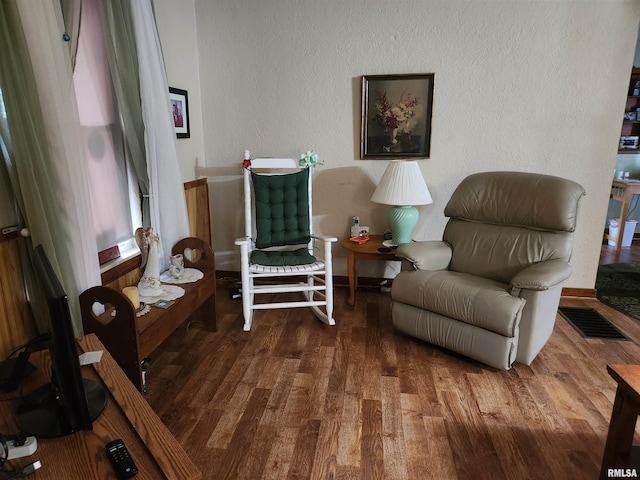 605 Pace Ave, Mount Vernon, IL 62864 - living area with wood finished floors, a textured wall, and baseboards