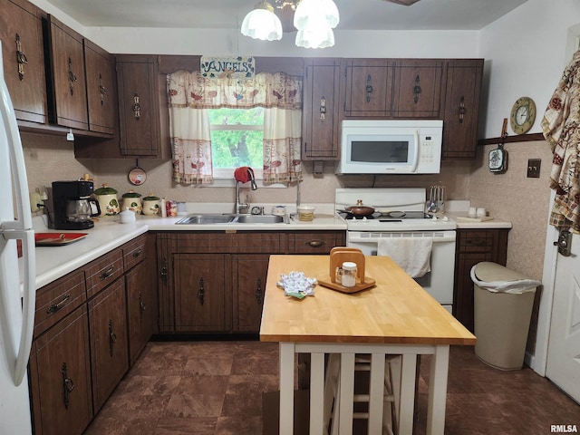 605 Pace Ave, Mount Vernon, IL 62864 - kitchen featuring white appliances, a sink, dark brown cabinets, and a chandelier