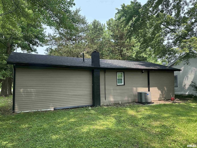1924 N 7th St, Murphysboro, IL 62966 - view of side of property with a yard, a chimney, and central air condition unit