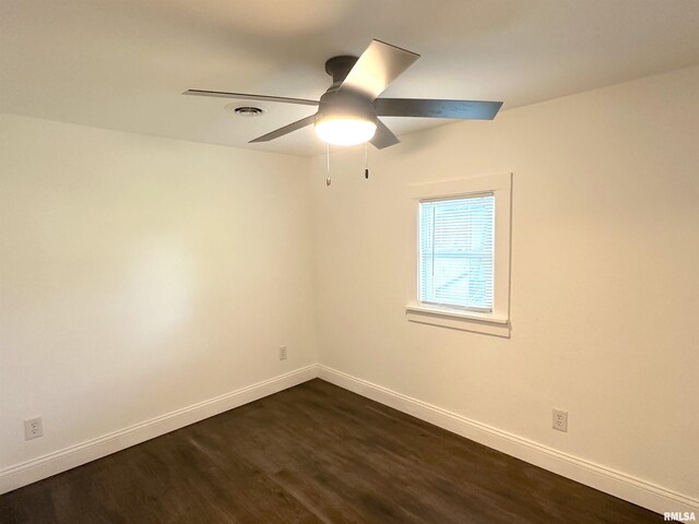 1924 N 7th St, Murphysboro, IL 62966 - spare room with dark wood-type flooring, baseboards, and a ceiling fan
