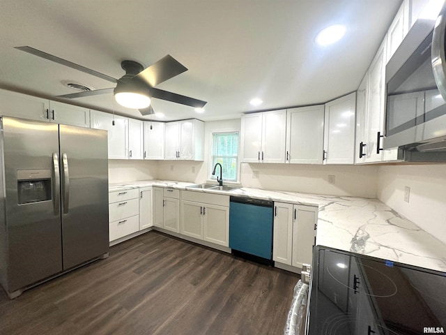 1924 N 7th St, Murphysboro, IL 62966 - kitchen featuring stainless steel appliances, a sink, dark wood-style flooring, white cabinets, and light stone counters