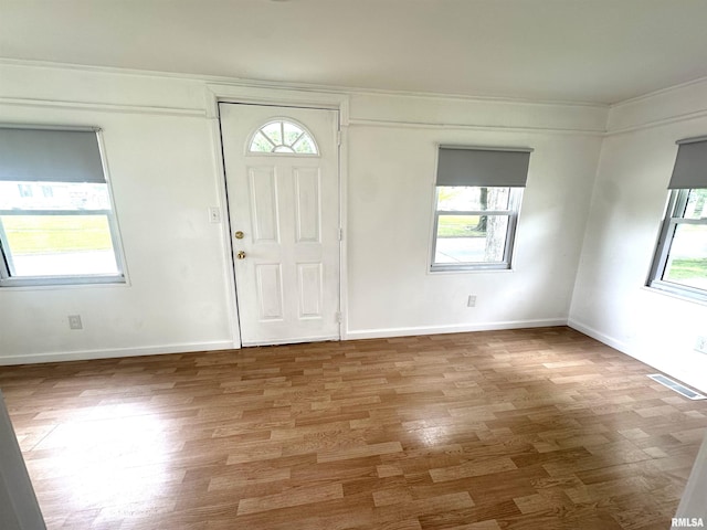 1206 E 2nd St, Centralia, IL 62801 - entrance foyer with wood finished floors, baseboards, and crown molding