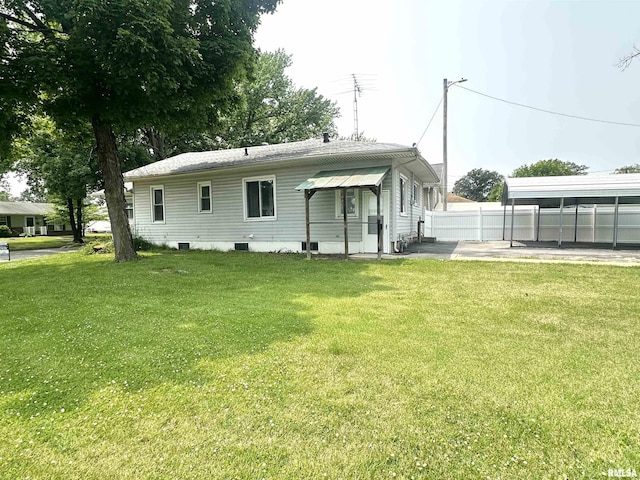 1206 E 2nd St, Centralia, IL 62801 - back of house with a detached carport and a patio area
