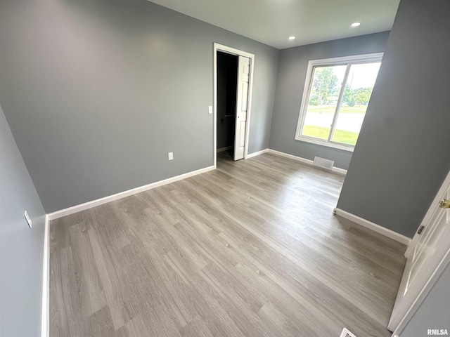 1206 E 2nd St, Centralia, IL 62801 - empty room featuring light wood-type flooring, baseboards, and recessed lighting
