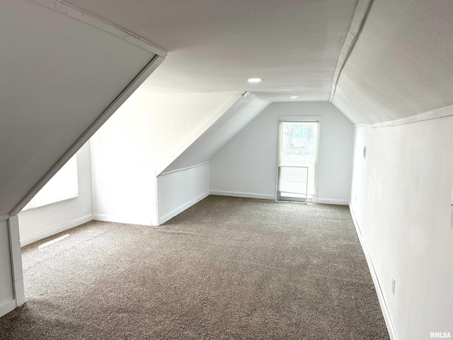 518 Noleman St, Centralia, IL 62801 - additional living space with carpet floors, vaulted ceiling, and baseboards