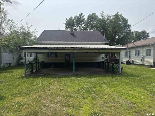 709 S Virginia St, Marion, IL 62959 - rear view of property featuring a lawn