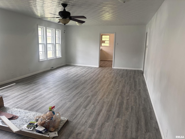 709 S Virginia St, Marion, IL 62959 - unfurnished living room featuring baseboards, wood finished floors, and ceiling fan