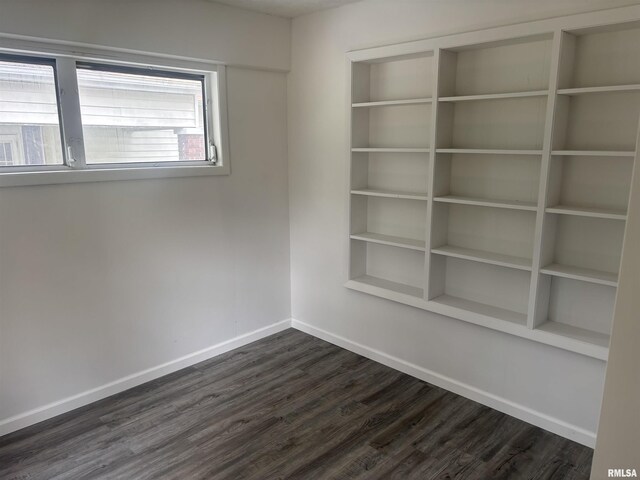 709 S Virginia St, Marion, IL 62959 - empty room featuring baseboards and dark wood-style floors