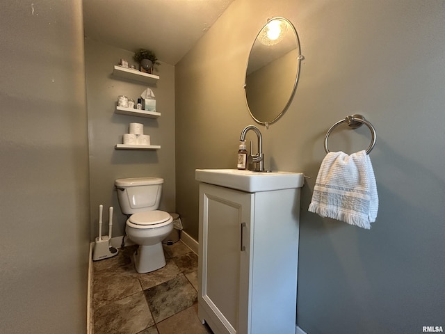 713 E Main St, Marion, IL 62959 - half bath featuring vanity, toilet, and baseboards