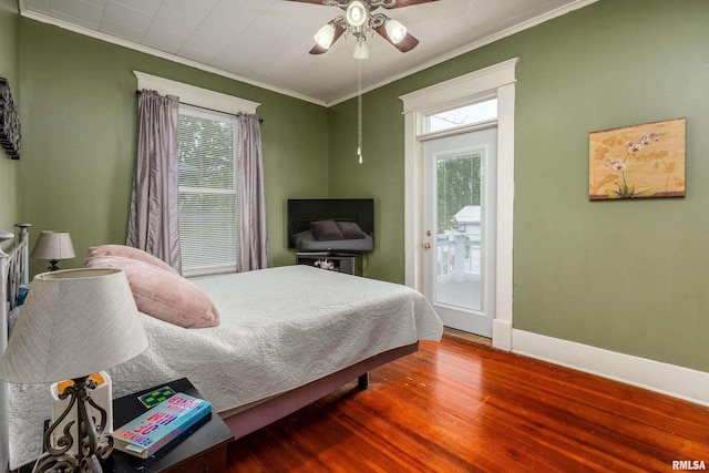 713 E Main St, Marion, IL 62959 - bedroom with crown molding, baseboards, wood finished floors, a ceiling fan, and access to exterior