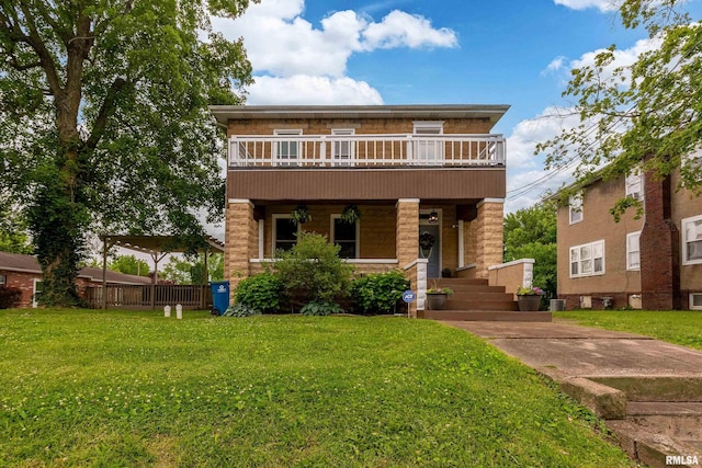 713 E Main St, Marion, IL 62959 - view of front property featuring a front lawn, a balcony, and covered porch