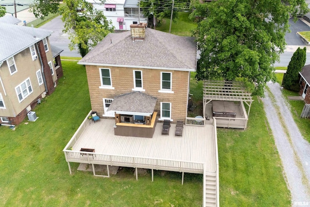 713 E Main St, Marion, IL 62959 - back of house with a shingled roof, a wooden deck, a chimney, and a yard