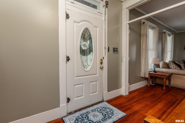713 E Main St, Marion, IL 62959 - foyer entrance featuring ornamental molding, dark wood-type flooring, and baseboards