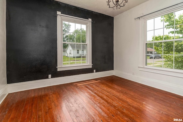 2112 Herbert St, Murphysboro, IL 62966 - empty room featuring hardwood / wood-style flooring, baseboards, and healthy amount of natural light