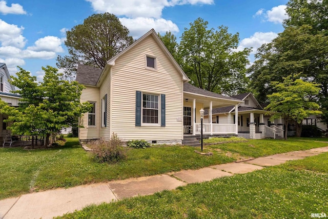 2112 Herbert St, Murphysboro, IL 62966 - view of front of home with covered porch, a front lawn, and a shingled roof