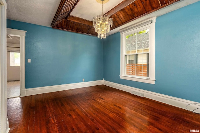 2112 Herbert St, Murphysboro, IL 62966 - unfurnished room featuring a chandelier, baseboards, plenty of natural light, and hardwood / wood-style floors