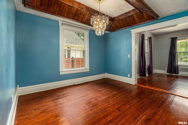 2112 Herbert St, Murphysboro, IL 62966 - spare room featuring wood-type flooring, a chandelier, and baseboards