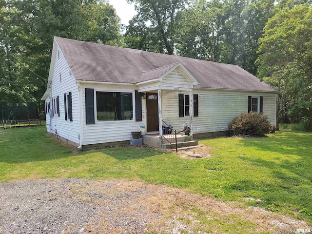7324 State Route 161st Ext, Iuka, IL 62849 - view of front of house featuring a front yard, a shingled roof, and view of scattered trees